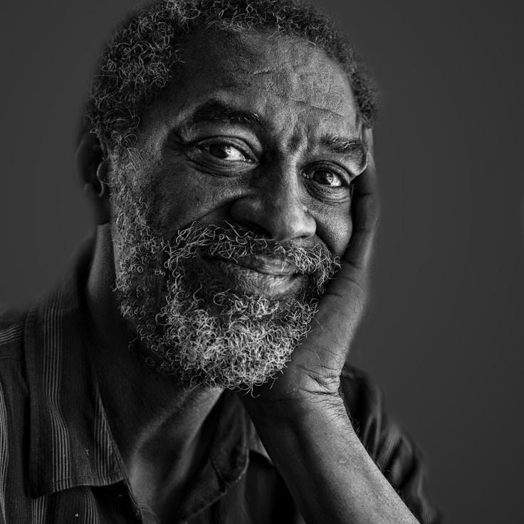 Kaveri Mehta, Lead Design Curator at Orchard Link Field, reviewing corporate floral arrangements